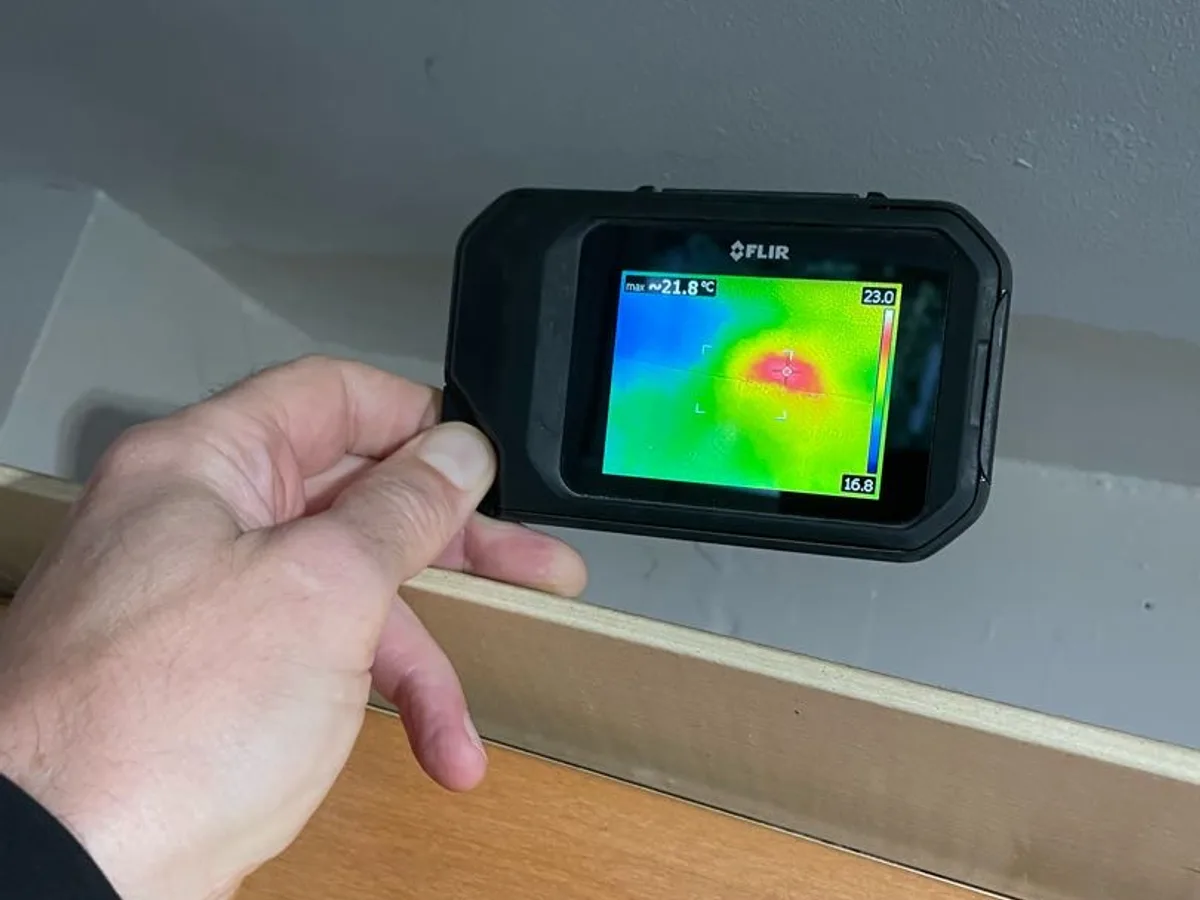 Thermal camera held up to a ceiling during ADI’s published Warwick investigation